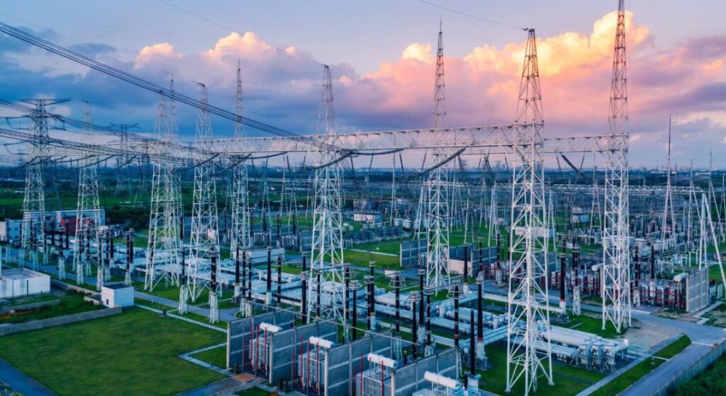 High-voltage electrical substation with transmission towers, switchgear, and power distribution infrastructure, highlighting Halker’s power engineering capabilities in grid reliability, system resilience, and large-scale energy delivery design.