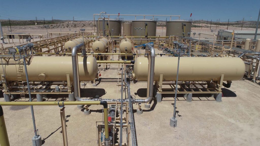 Salt Water Disposal (SWD) facility featuring horizontal pressure vessels, tank batteries, and interconnected process piping, showcasing Halker’s engineering and infrastructure expertise in produced water handling, treatment, and reliable midstream disposal system design.