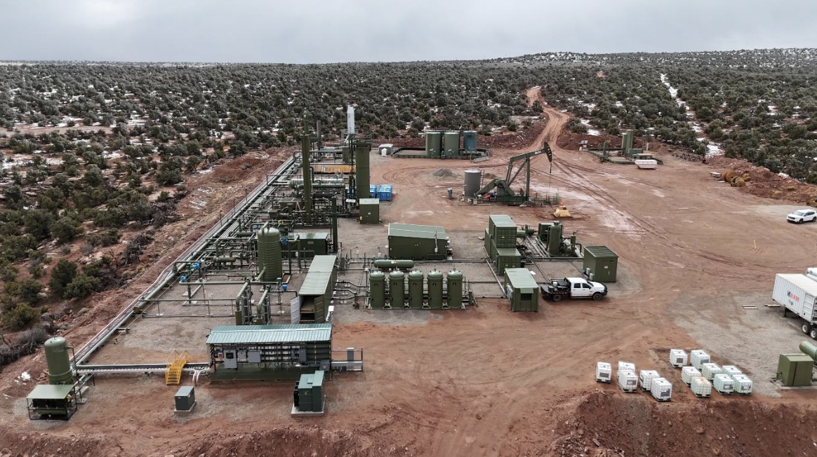 Aerial view of a remote helium processing plant with modular equipment skids, separators, compressors, and process piping arranged on a cleared desert site, highlighting Halker’s expertise in helium plant engineering, facility design, and specialty gas processing infrastructure.